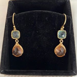 Gold tone earrings with blue and peach stones